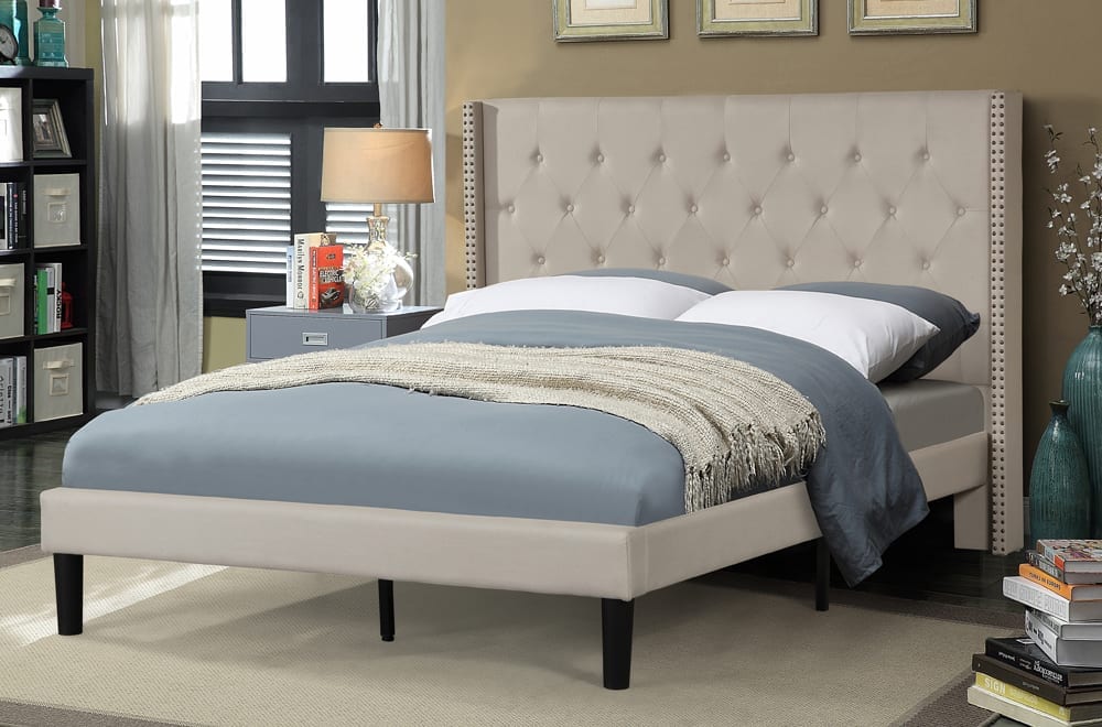Bedroom with a tufted headboard and bedding