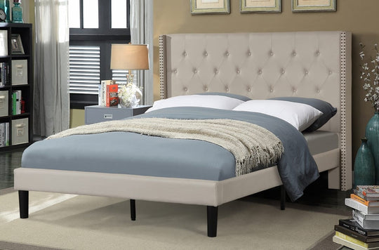 Bedroom with a tufted headboard and bedding